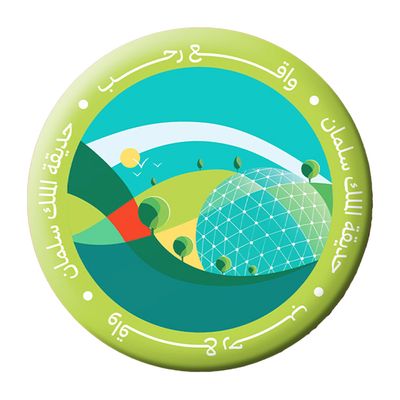 A Metal Brooch With The King Salman Garden Logo